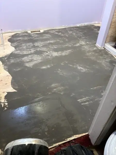 Levelling compound spread over the old floor