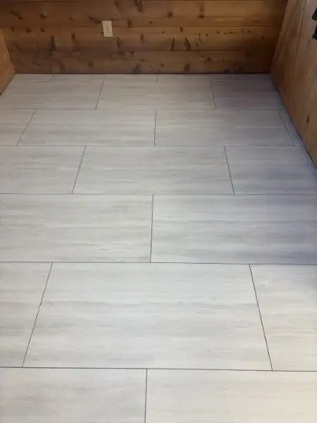 A finished glue-down vinyl tile floor
