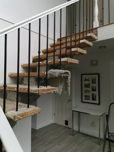 Old carpet stripped off an open staircase