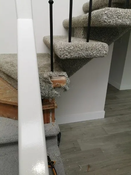 Carpet cut in around the spindles