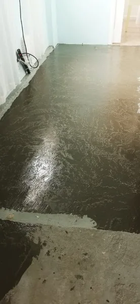 Levelling compound spread over an old floor in Mission