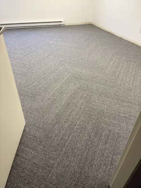 Finished glue-down carpet tile in a Pitt Meadows warehouse unit